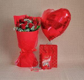 red roses chocolates and balloon