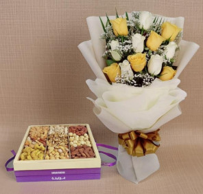 yellow white roses bouquet and nuts
